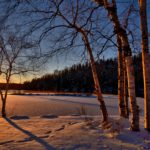 Sonnenuntergang in verchneiter Seelandschaft